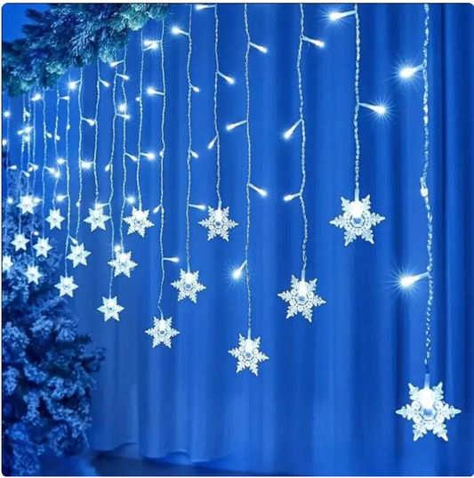 LED snowflake fairy curtain lights creating warm cozy room atmosphere